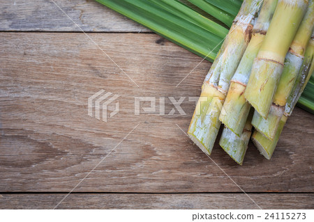 Top view fresh sugar cane and leaf on wooden 24115273
