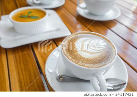 Latte Coffee art on the wooden table . Latte Coffee art on the wooden table . 24117421