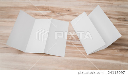 Trifold white template paper on wood texture . 24118097