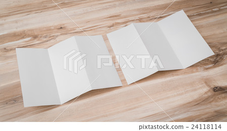 Trifold white template paper on wood texture . 24118114