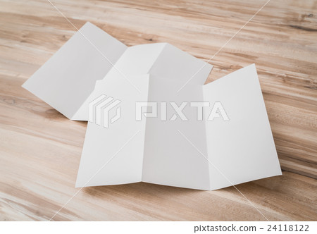 Trifold white template paper on wood texture . 24118122