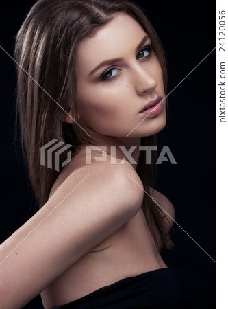 Beautiful woman on black bakcground 24120056
