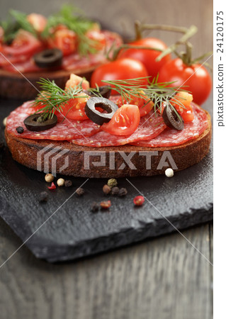 open rye sandwich with salami and vegetables 24120175