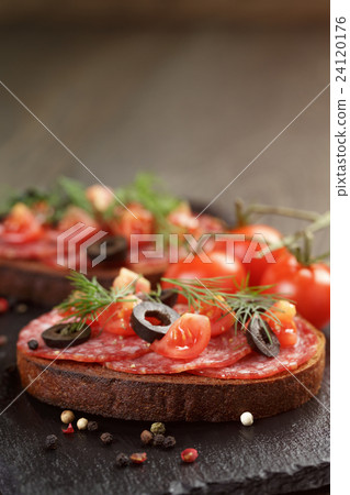 open rye sandwich with salami and vegetables 24120176
