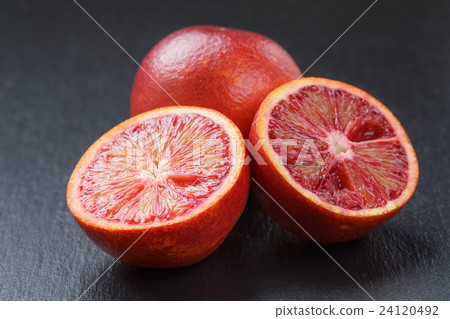 red sicilian oranges sliced on slate board 24120492