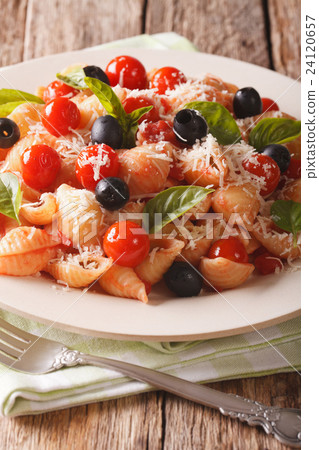 Conchiglie with tomatoes, olives and parmesan Conchiglie with tomatoes, olives and parmesan 24120657