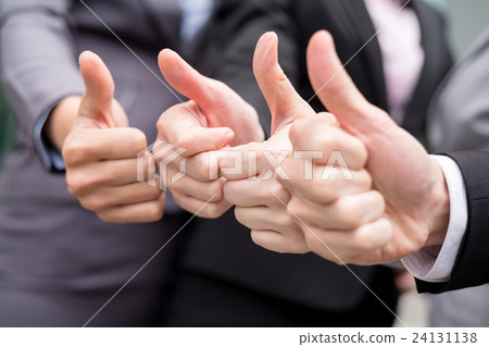 Business partners keeping thumbs up 24131138