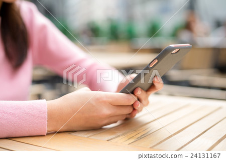 Woman use of mobile phone at outdoor Woman use of mobile phone at outdoor 24131167