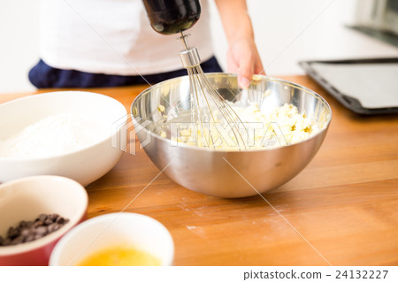 Woman mixing the butter Woman mixing the butter 24132227