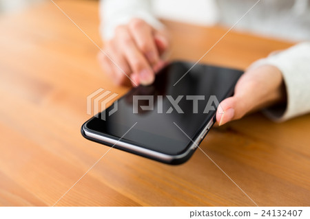Woman using mobile phone Woman using mobile phone 24132407