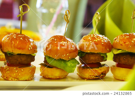 mini hamburger with salad leaf served on plate 24132865