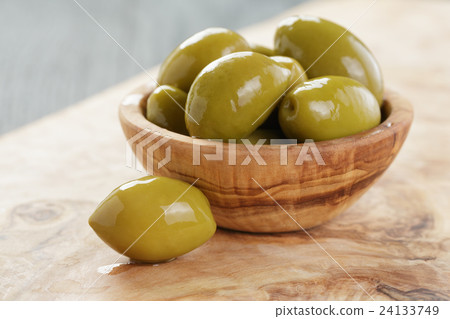 giant green olives in olive bowl on wood giant green olives in olive bowl on wood 24133749
