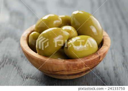 giant green olives in olive bowl on wood giant green olives in olive bowl on wood 24133750