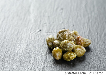 marinated capers on slate board marinated capers on slate board 24133754