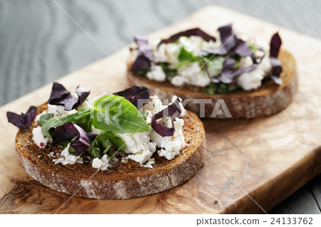 rye sandwich or bruschetta with ricotta, herbs 24133762