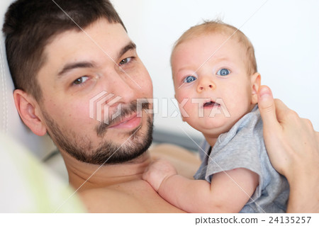 Newborn with his father Newborn with his father 24135257
