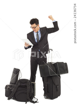 Angry businessman holding a tablet Angry businessman holding a tablet 24136734