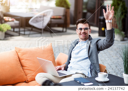 Joyful businessman sitting in the cafe 24137742