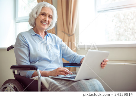 Disabled woman using computer 24139814