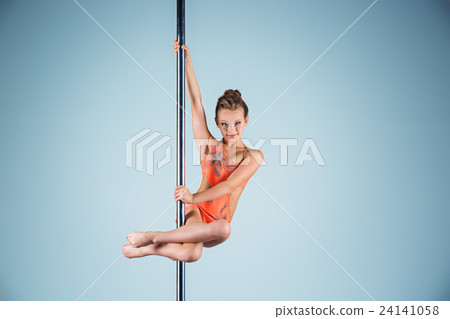 The strong and graceful young girl performing The strong and graceful young girl performing 24141058