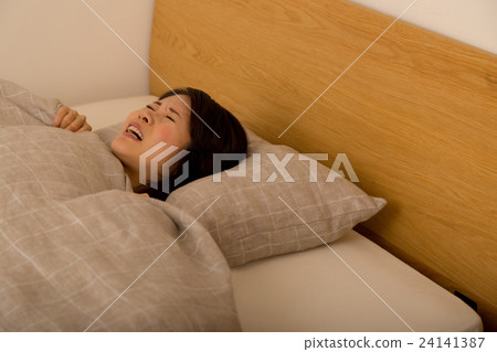 Sleeping woman watching a nightmare woman sleeping in bed sleeping bed futon fluffy futon 24141387
