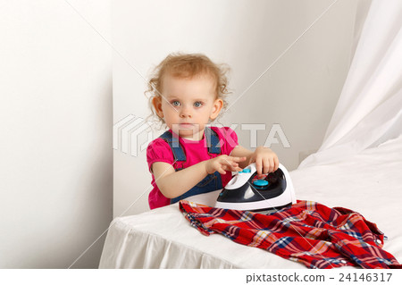 Nice little girl with an iron. Nice little girl with an iron. 24146317