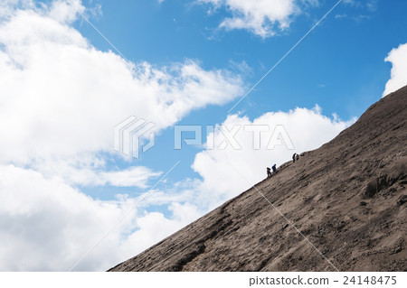 Group of people walking up to the peak on mountain 24148475