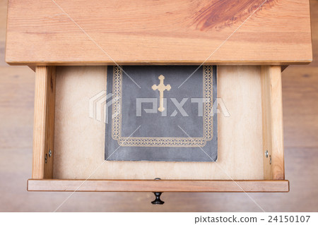 Bible book in open drawer 24150107