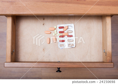 several pills in open drawer several pills in open drawer 24150698