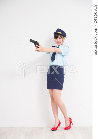 A woman who performed a cosplay of a woman policeman with a toy pistol A woman who performed a cosplay of a woman policeman with a toy pistol 24150918