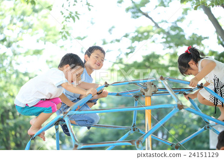 Children playing with playground equipment 24151129