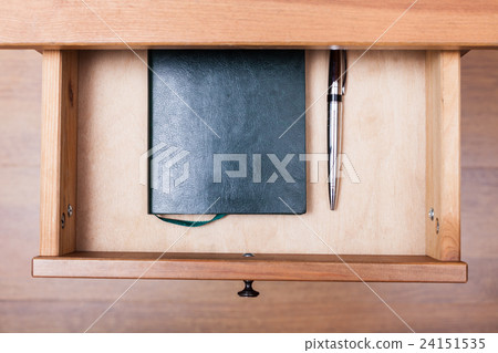 modern pen and notebook in open drawer modern pen and notebook in open drawer 24151535