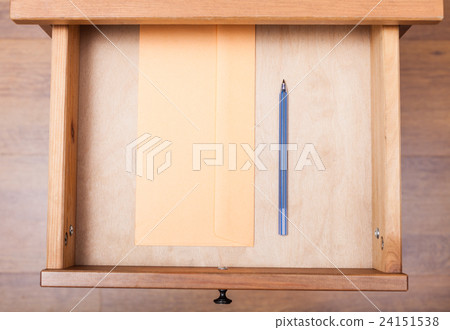 blue pen and envelope in open drawer 24151538