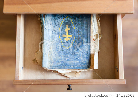 shabby ritual book in open drawer 24152505