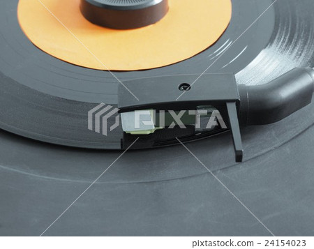 Vinyl record on turntable 24154023