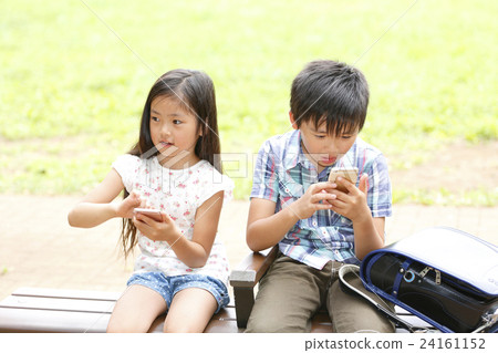 Child with smartphone Child with smartphone 24161152