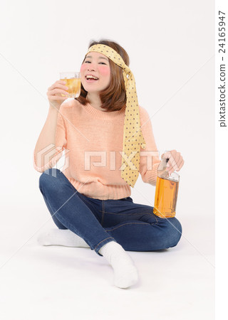 A young woman drinking whiskey and drunk 24165947