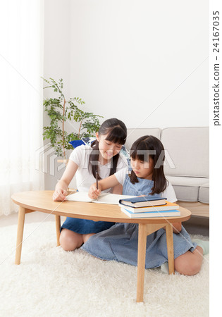 My sister teaches studying to her sister 24167035