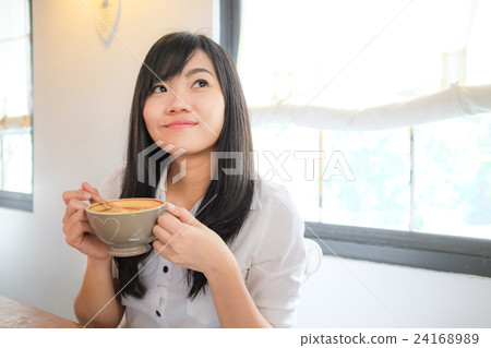 Asian young woman hold coffee cup 24168989