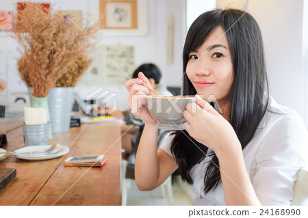 Asian young woman hold coffee cup 24168990