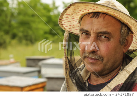 portrait of a beekeeper on apiary 24171087