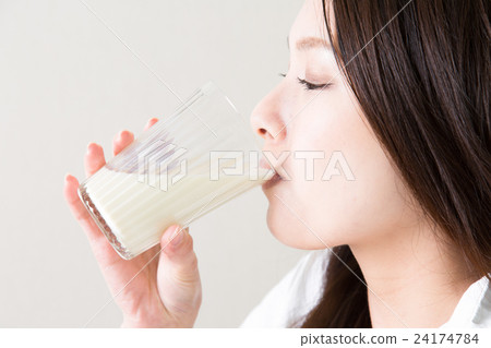 A woman drinking soy milk A woman drinking soy milk 24174784