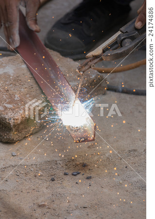 Welder working a welding metal Welder working a welding metal 24174886