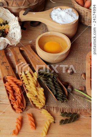 Raw homemade italian pasta colorful for cooking. 24174994