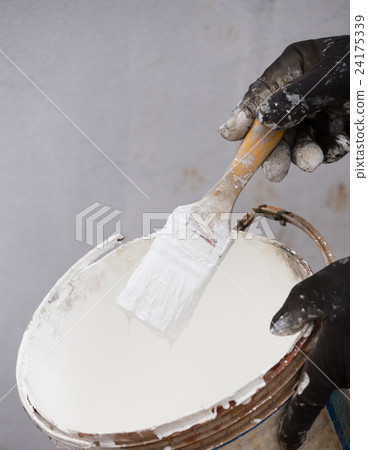 white paint brush with paint tin 24175339