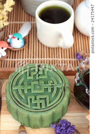 Festival moon cake - china dessert with green tea. Festival moon cake - china dessert with green tea. 24175447