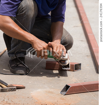worker using grinder to grinding metal worker using grinder to grinding metal 24176394