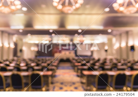 Abstract blurred photo of conference hall or seminar room with attendee background Abstract blurred photo of conference hall or seminar room with attendee background 24179504