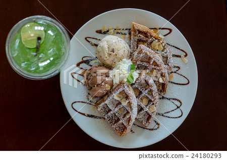 Top view of Waffles with ice cream on the plate, lemon tea with ice 24180293