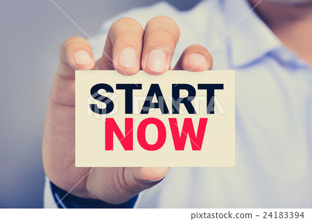 START NOW message on the card shown by a man START NOW message on the card shown by a man 24183394